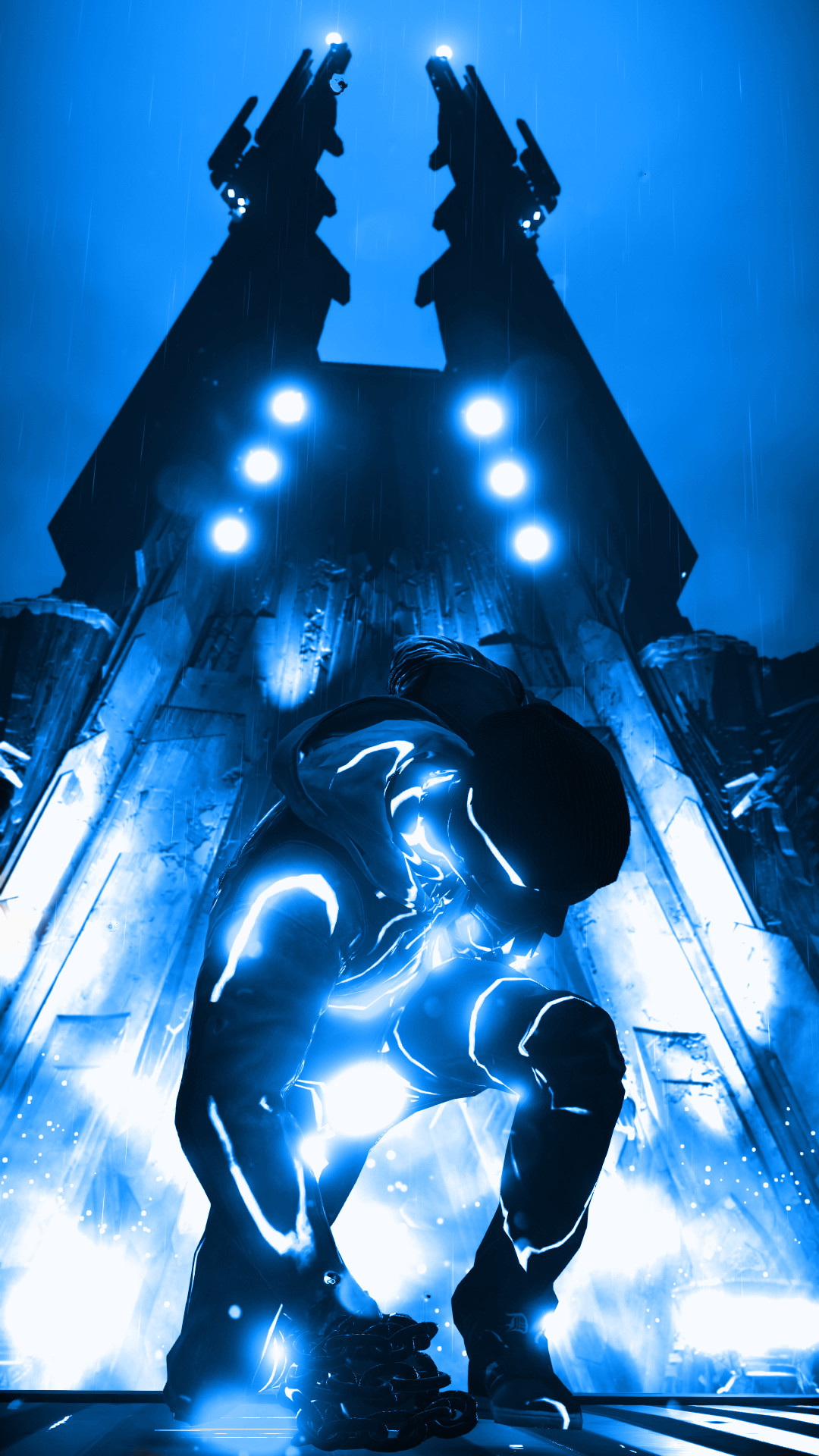 A futuristic, neon-blue figure crouches in front of a towering structure in a rainy, otherworldly setting. The figure and building glow with electric blue light, creating a striking contrast against the dark, rainy backdrop