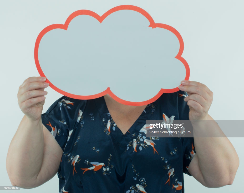 Closeup Of Overweight Mature Woman Holding Cloud Shape Paper