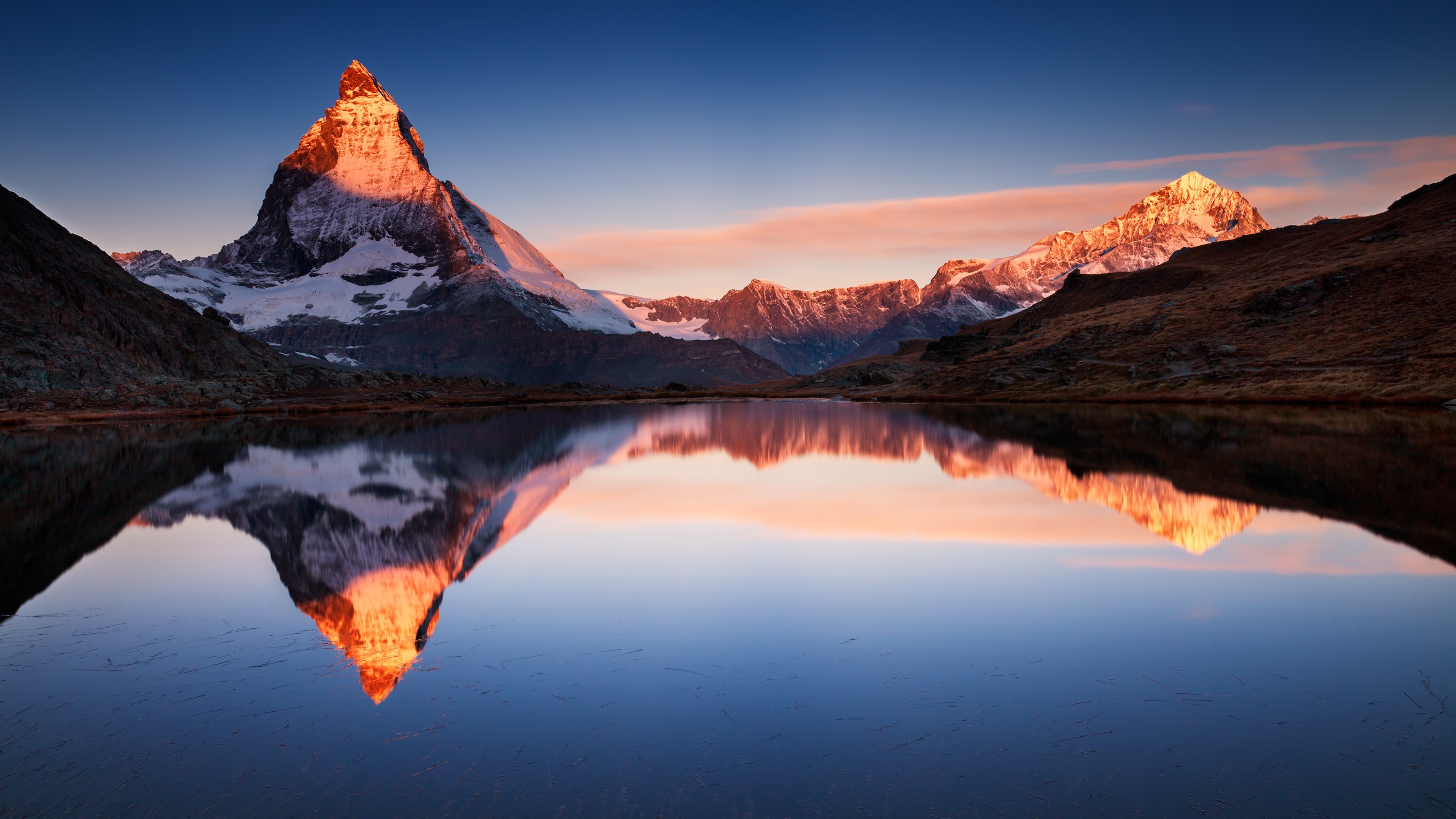 Sunrise over the Matterhorn and its reflection in Riffelsee lake in Switzerland, 4K HD wallpaper