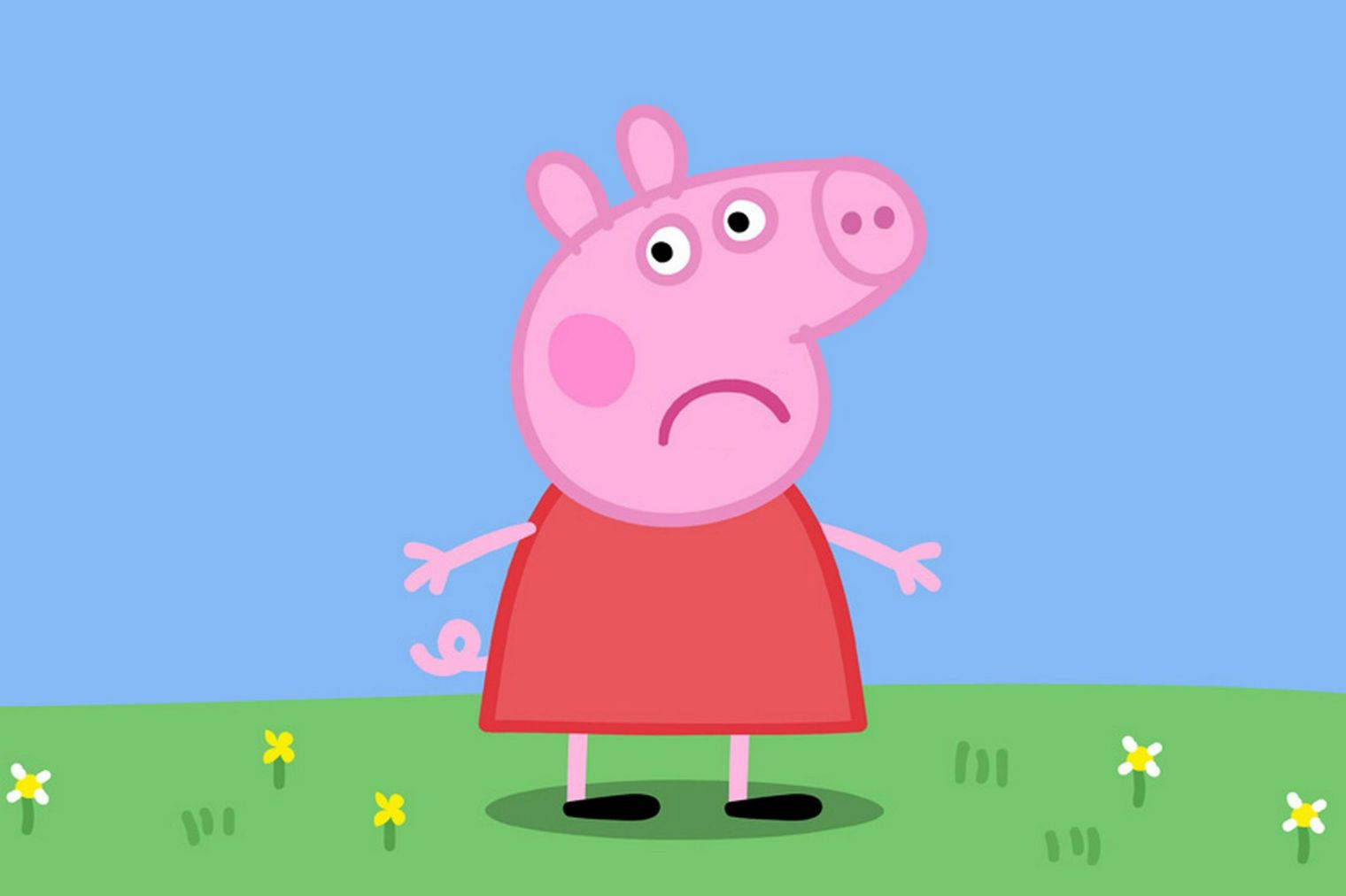 Peppa Pig looking sad in a field