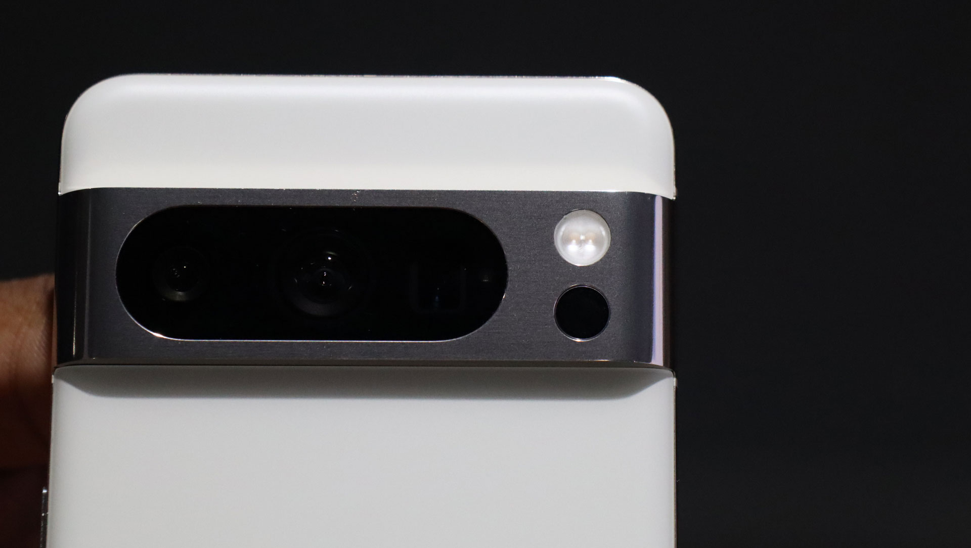 Close-up of the camera module on the back of a white Google Pixel phone