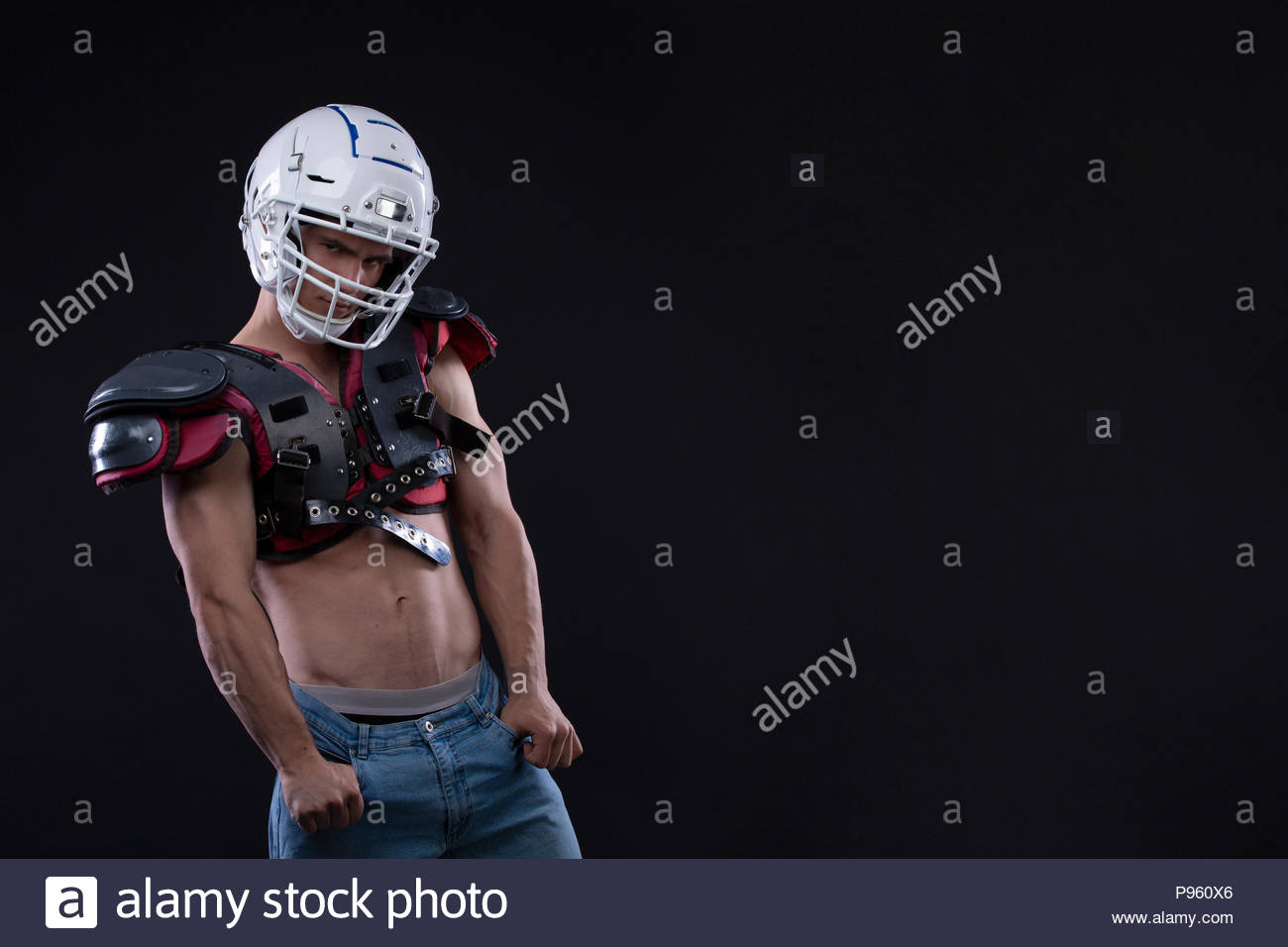 American football player wearing helmet and protective shields on