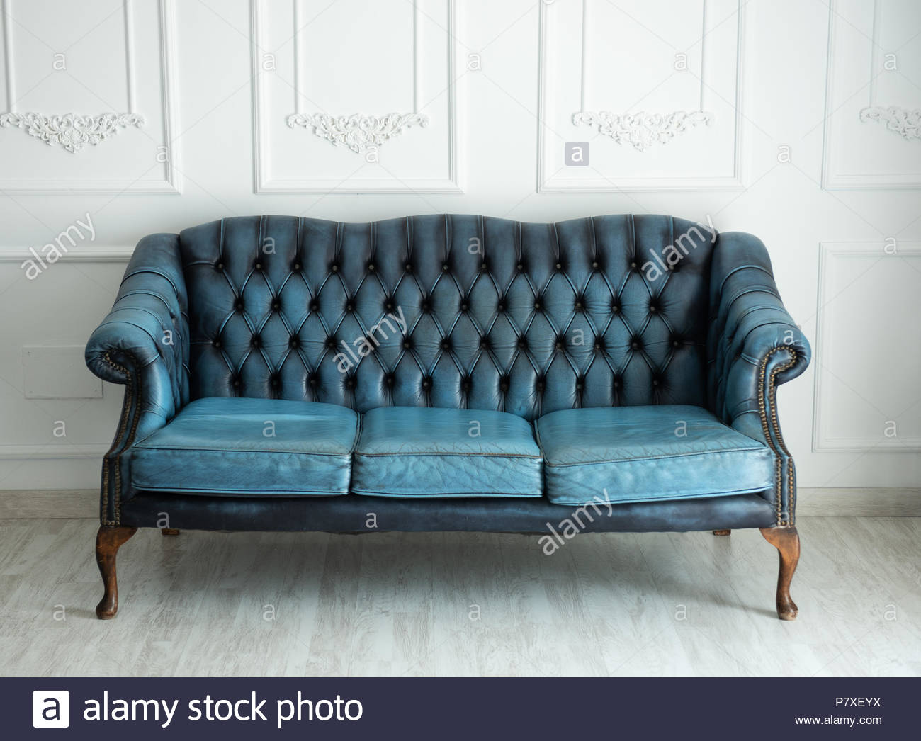 Beautiful Antique Blue Sofa On A Light Background Stock Photo