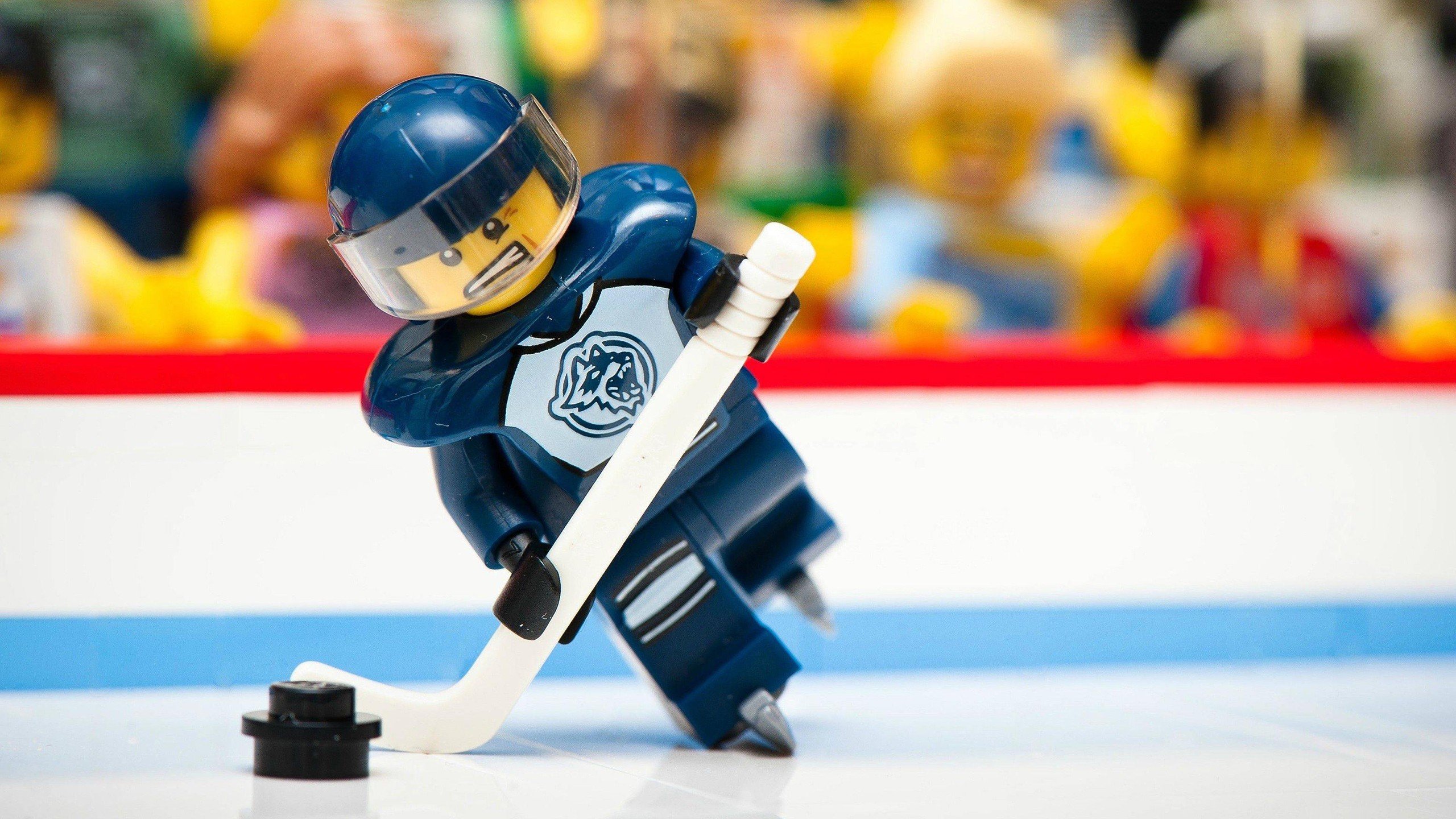 Lego hockey player about to strike the puck