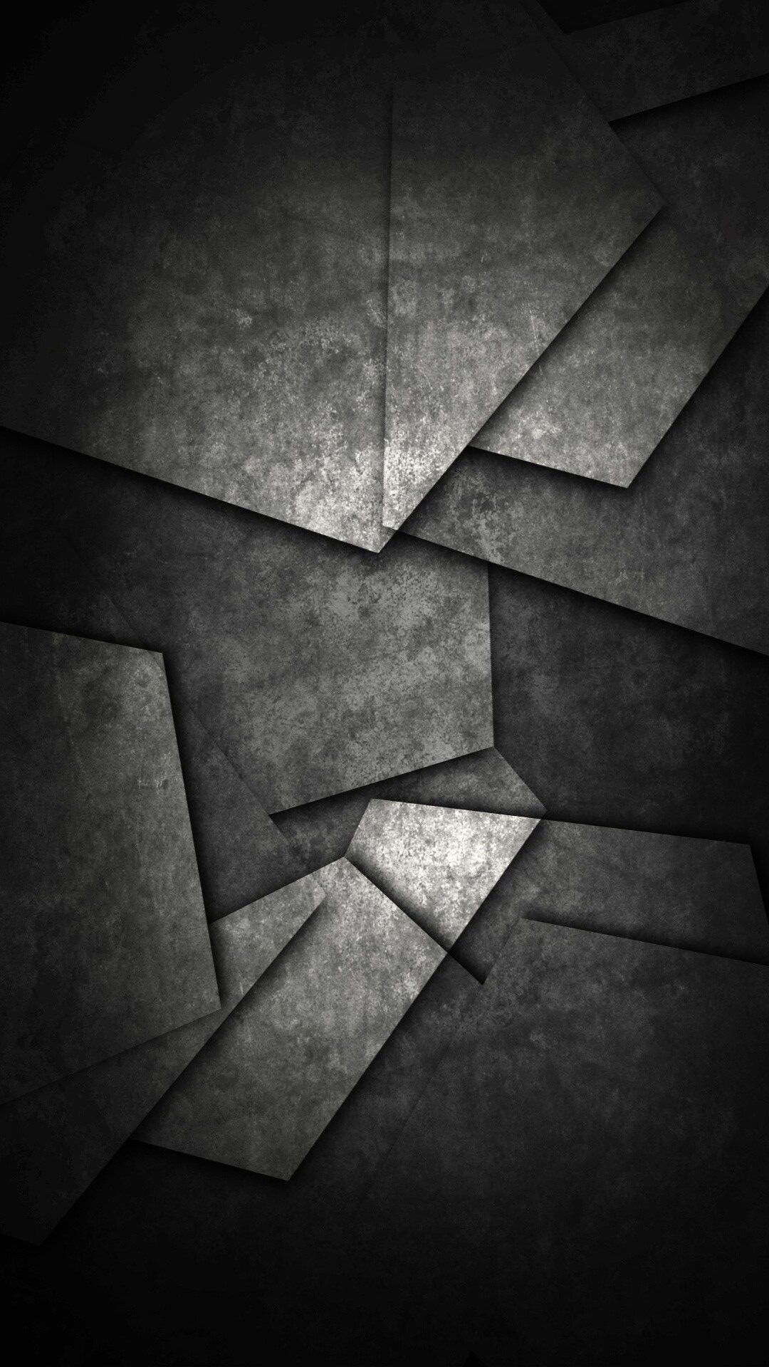 Abstract dark gray geometric background with textured layers, suitable for a modern and sophisticated wallpaper