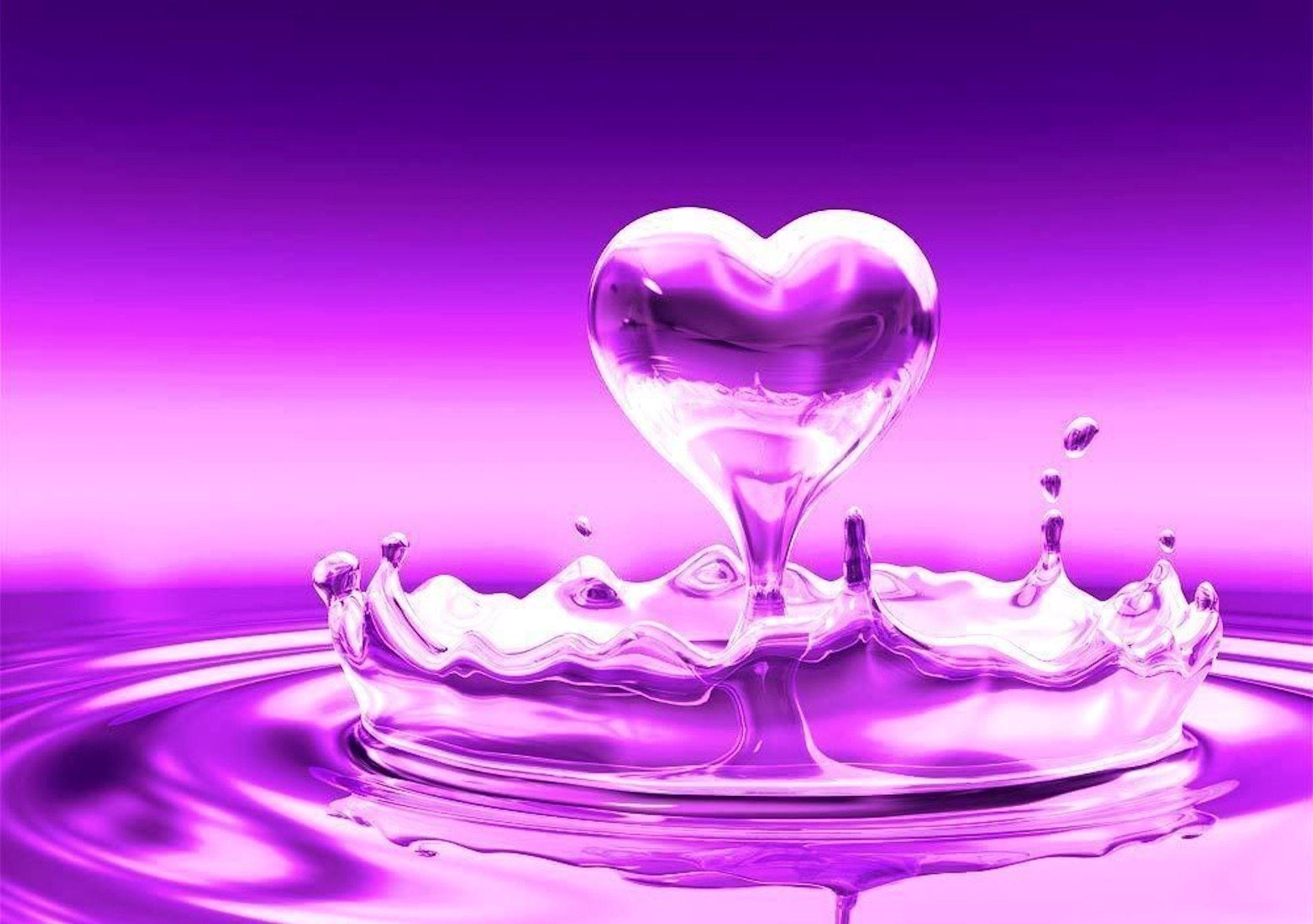 A purple liquid heart splashing into a pool of the same color, creating ripples and droplets around it. Perfect for Valentine's Day or any romantic occasion