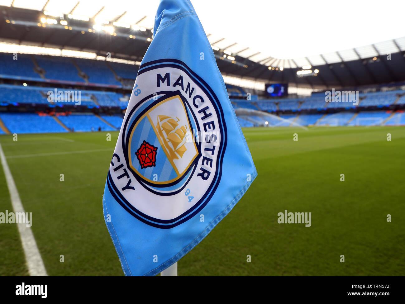 A Manchester City branded corner flag as the pitch is watered