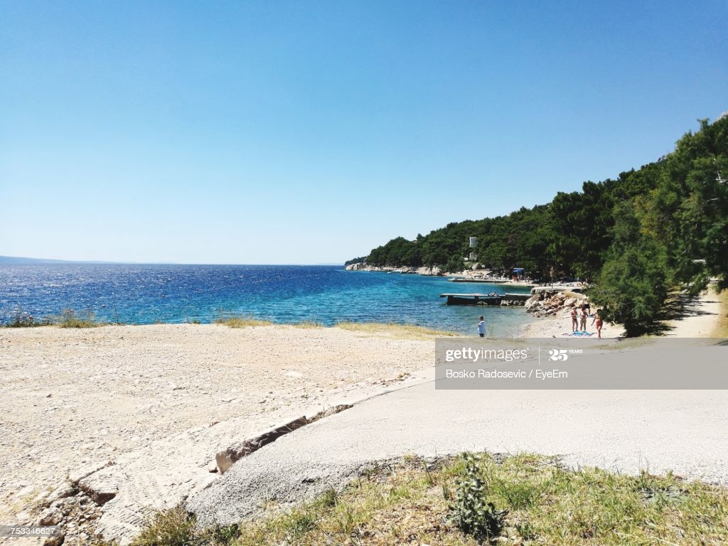 Scenic Of Beach Against Clear Blue Sky High Res Stock Photo