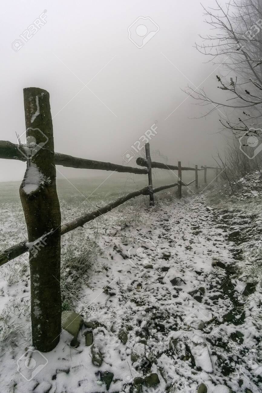 Winter Footpath Around Wooden Corral With Fog On Background Stock