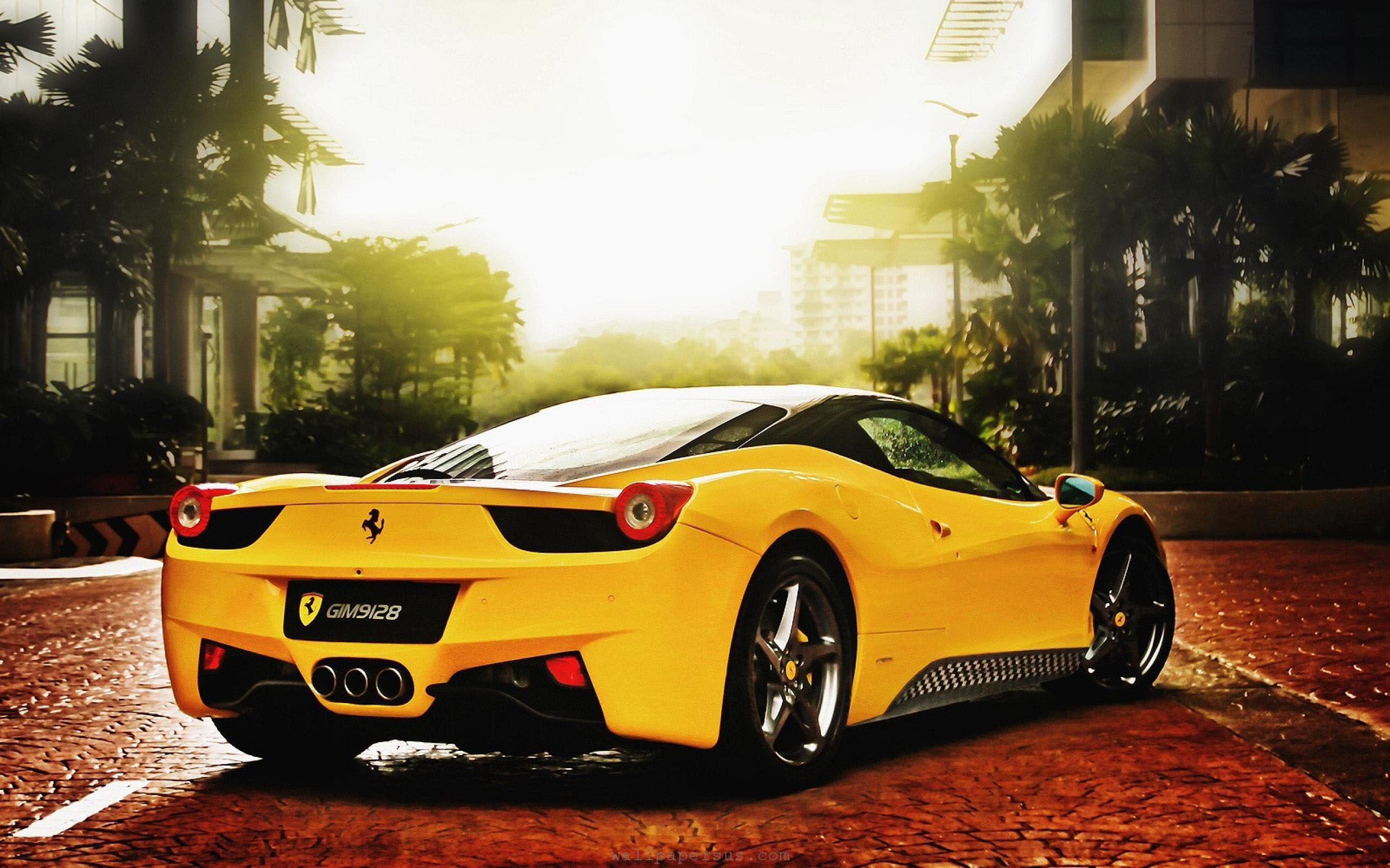 A vibrant yellow Ferrari 458 Italia parked on a brick road, glistening in the golden sunlight