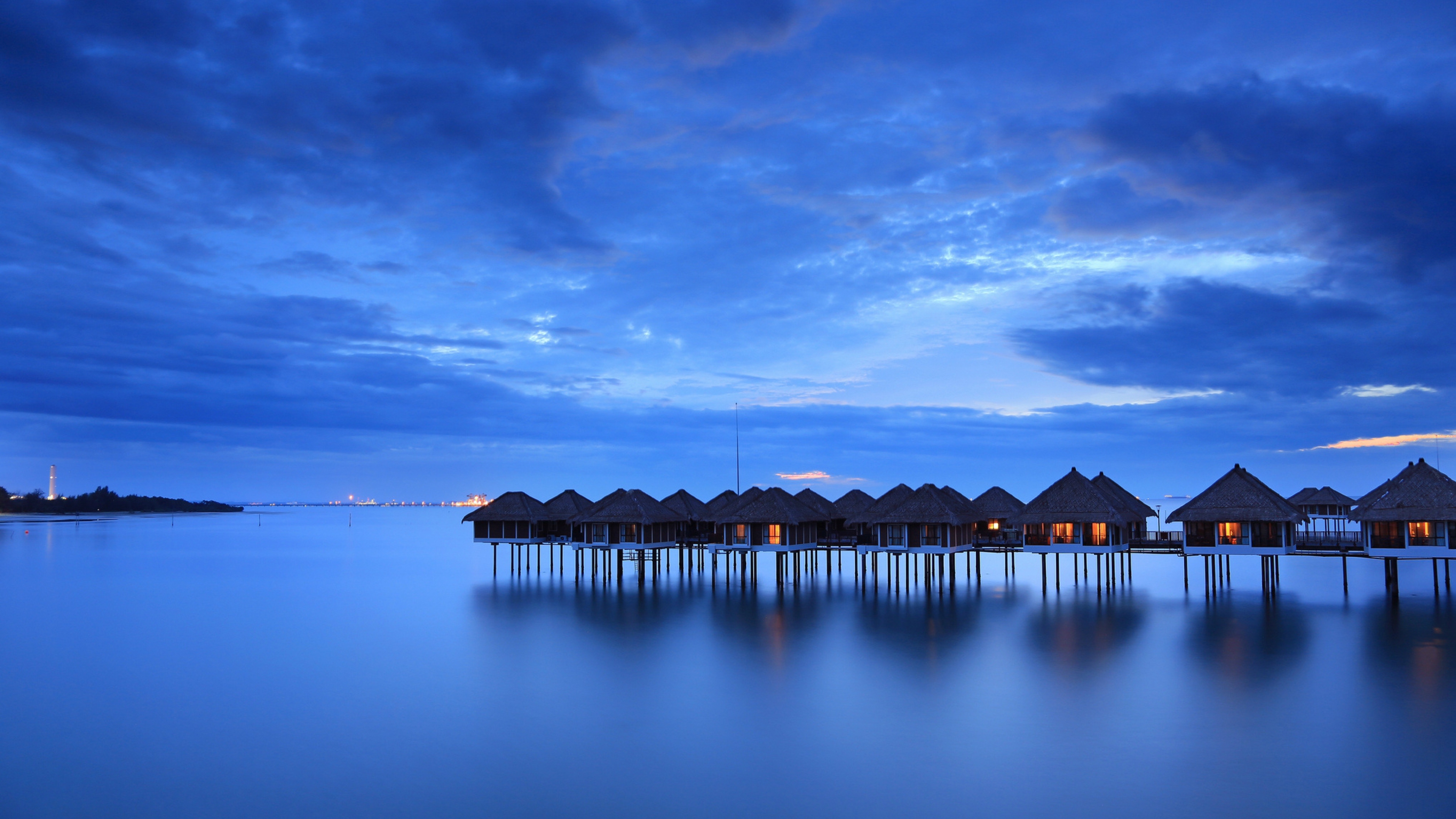 Serene Overwater Bungalows at Dusk