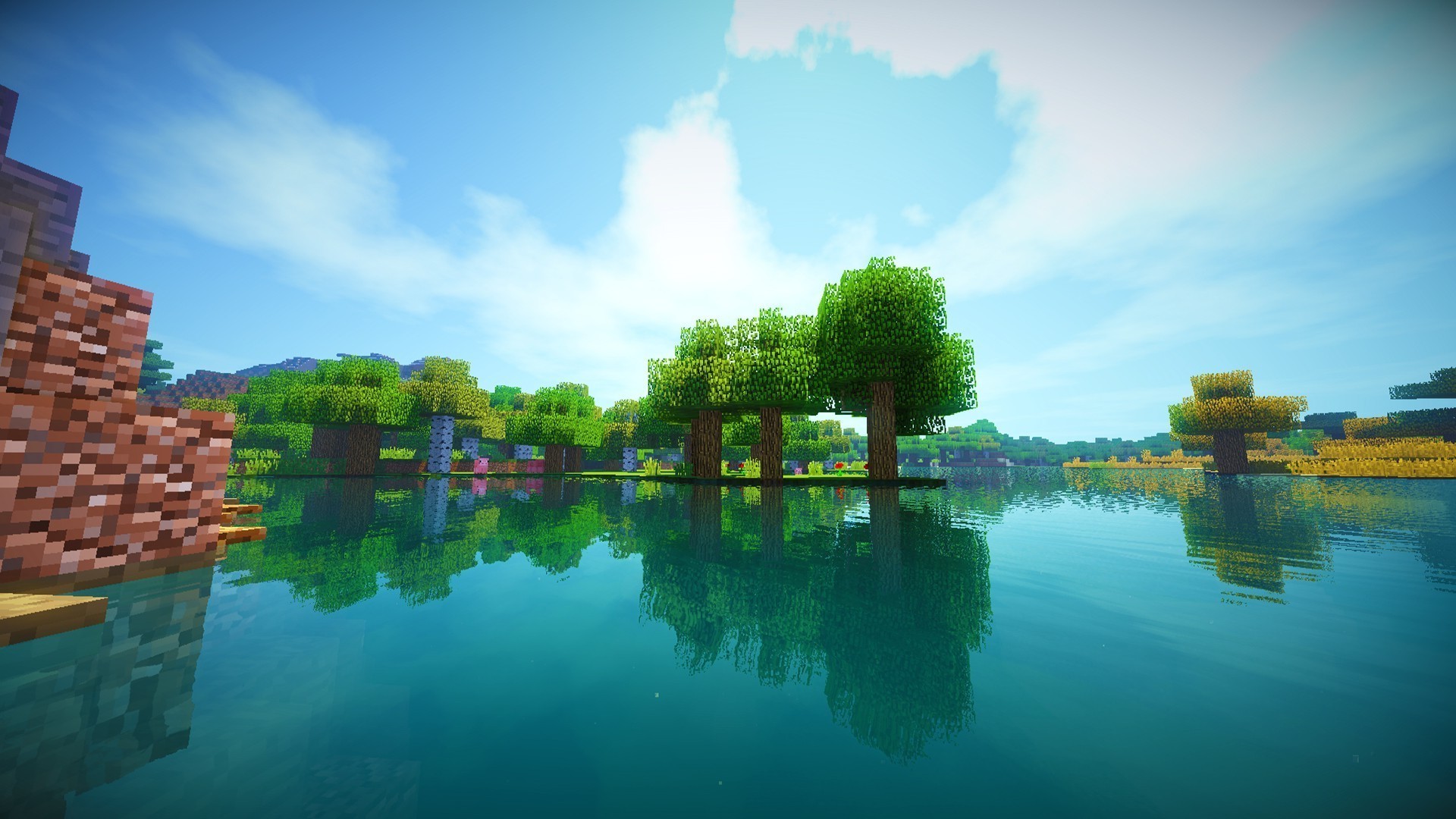 HD Minecraft wallpaper of a serene lake scene with lush trees and reflections