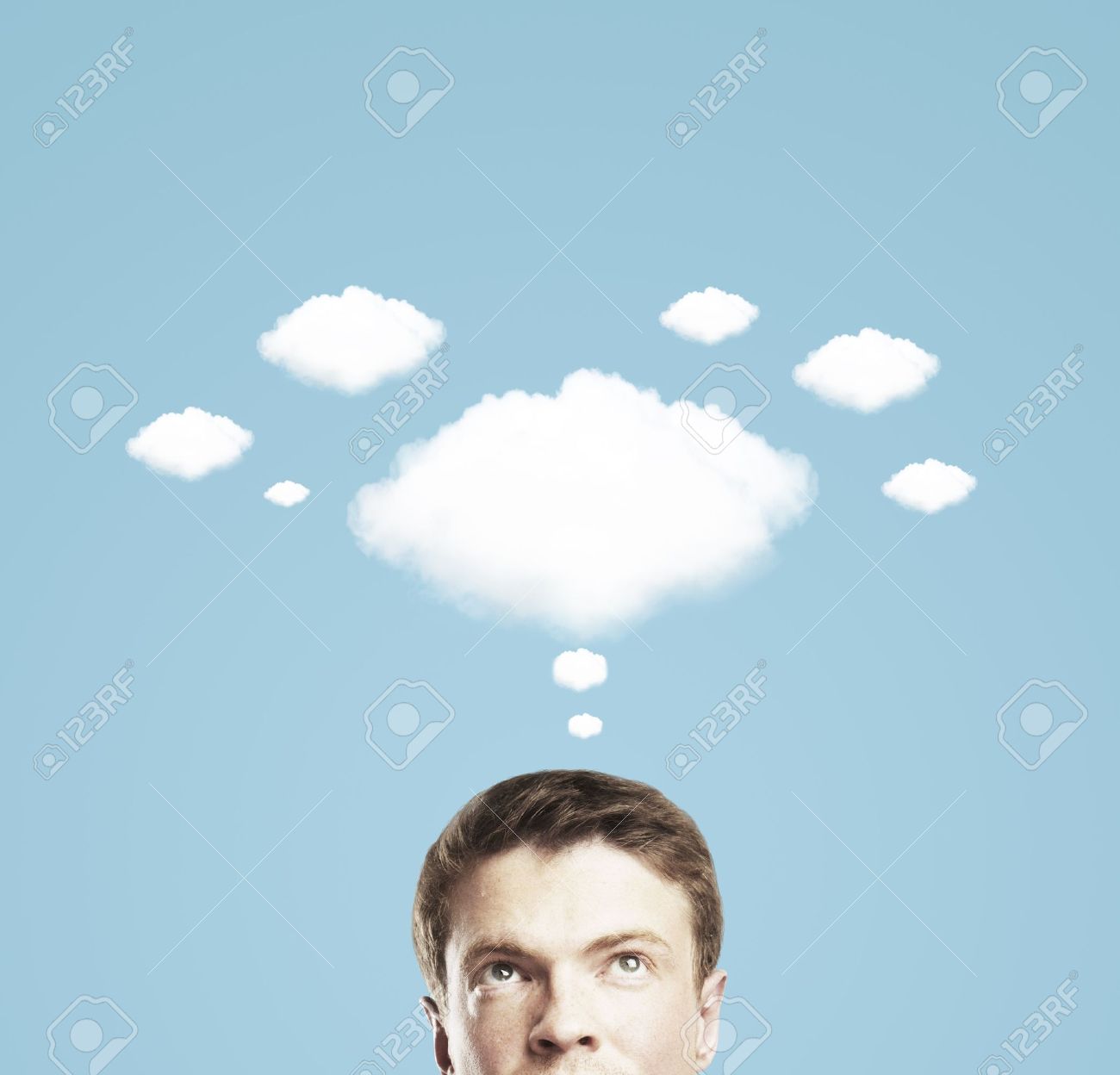 Businessman And A Cloud Of Thoughts On Blue Background Stock