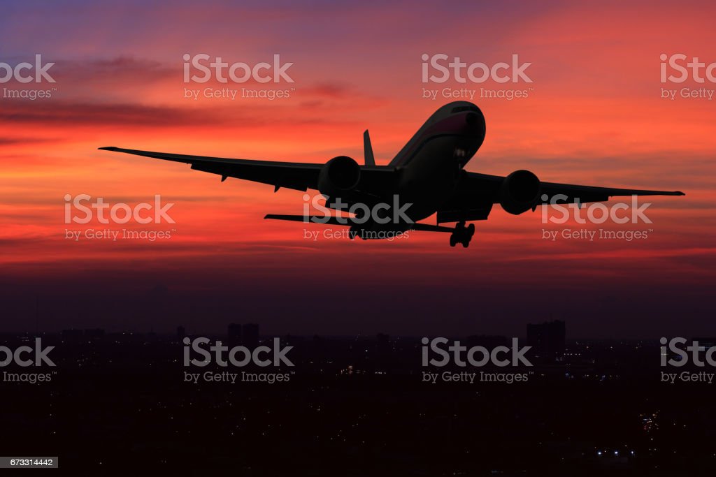 Commercial Airplane Flying Over The Night Scene City On Beautiful