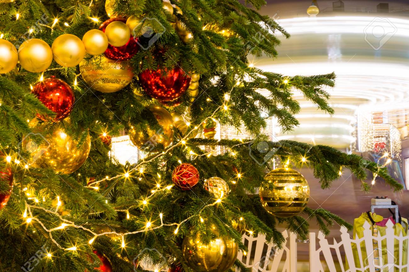 Christmas Fair Tree And A Rotating Carousel Bright