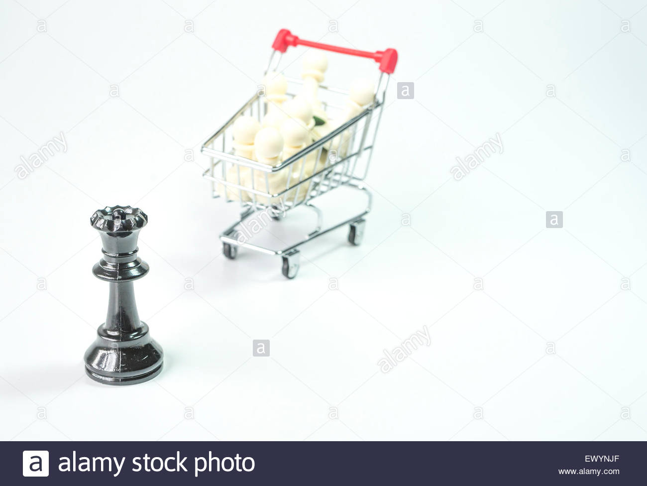 Black Queen And White Pawn Inside Trolley Background Stock Photo