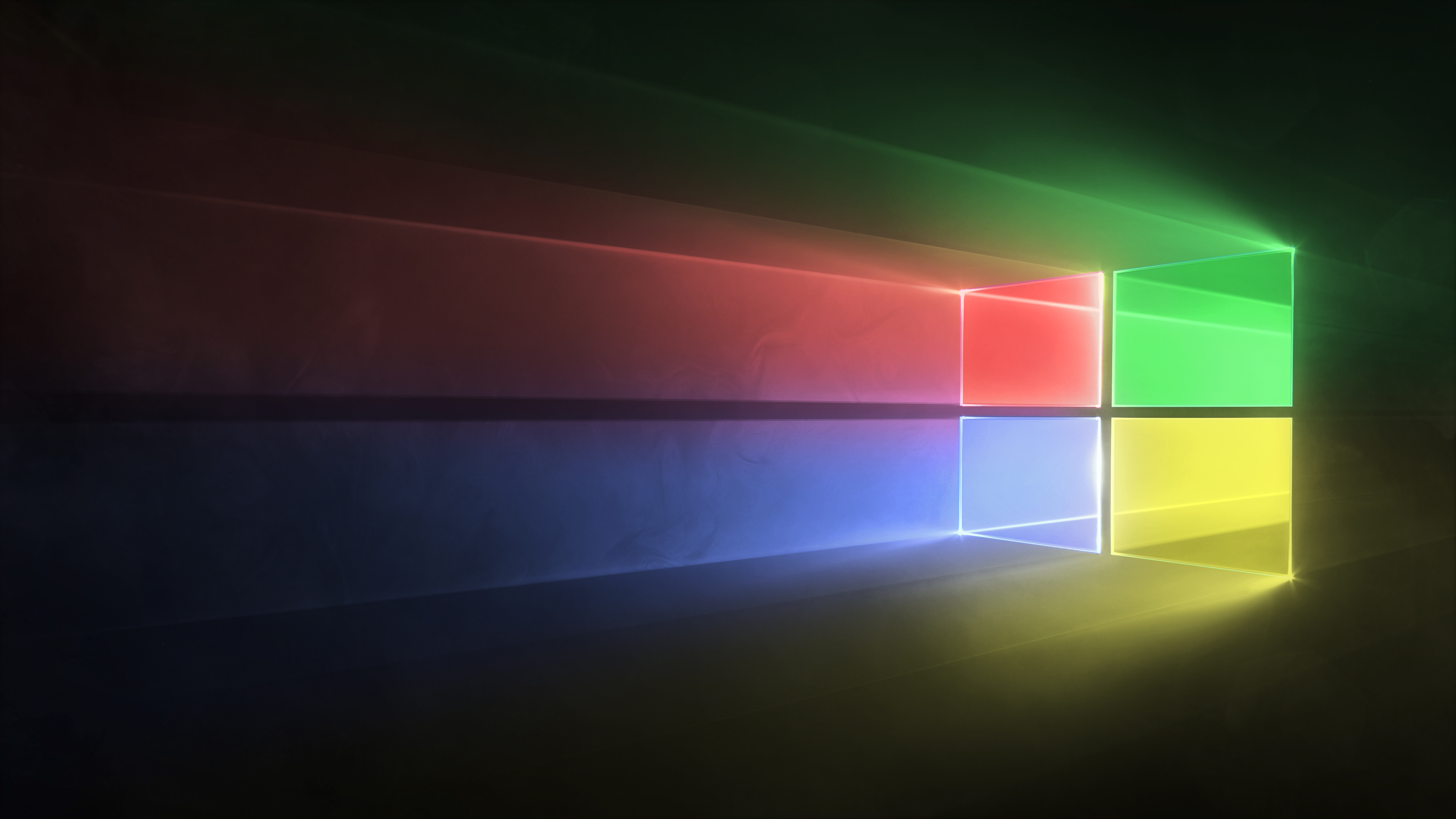 A vibrant 4K wallpaper featuring the classic Windows logo in bright, neon colors against a dark background