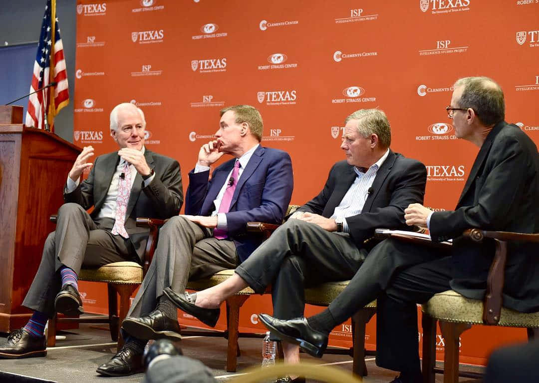 John Cornyn On A Stage With Peers Wallpaper