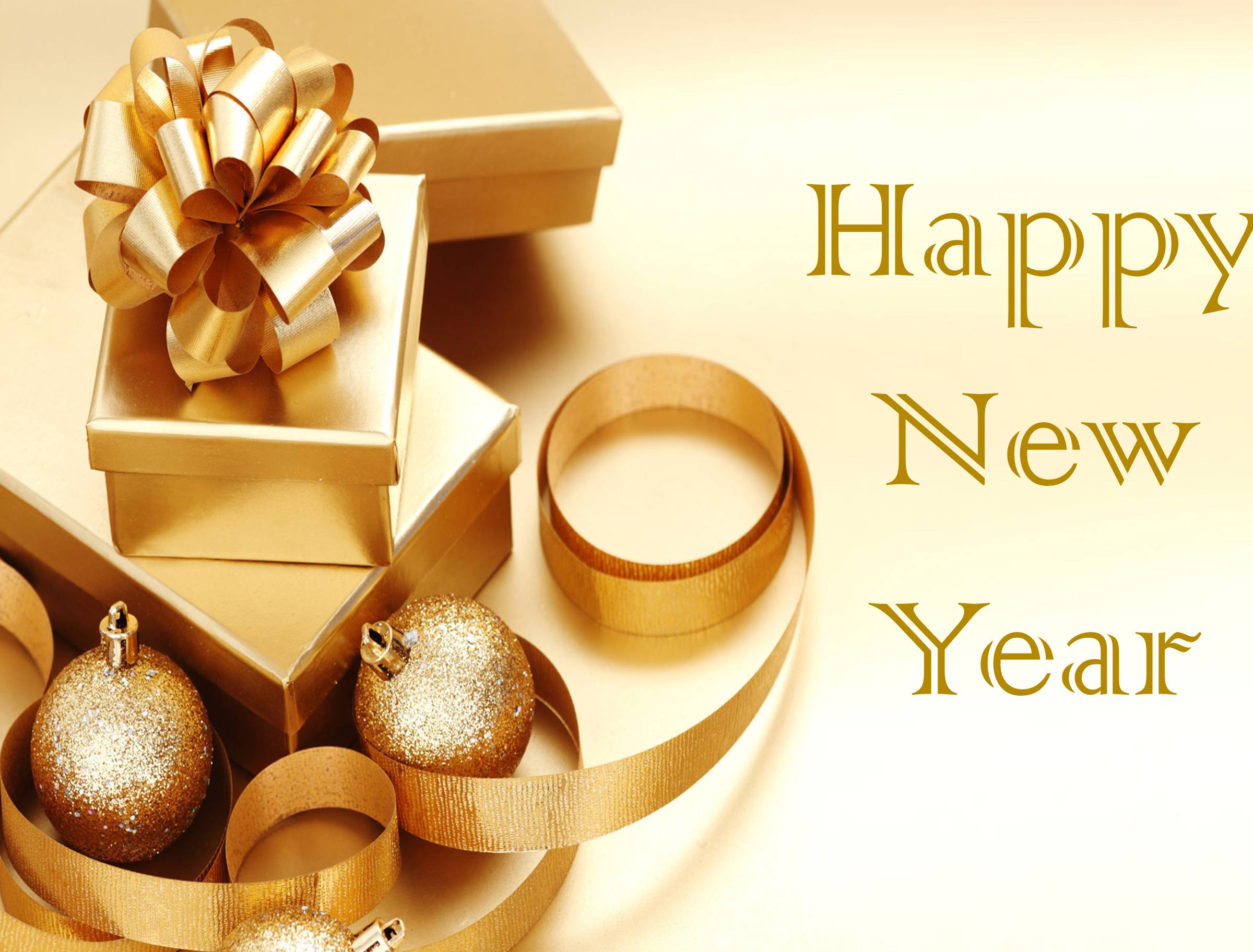 Golden New Year decorations with gift boxes, ornaments, and ribbons on a shimmering gold background