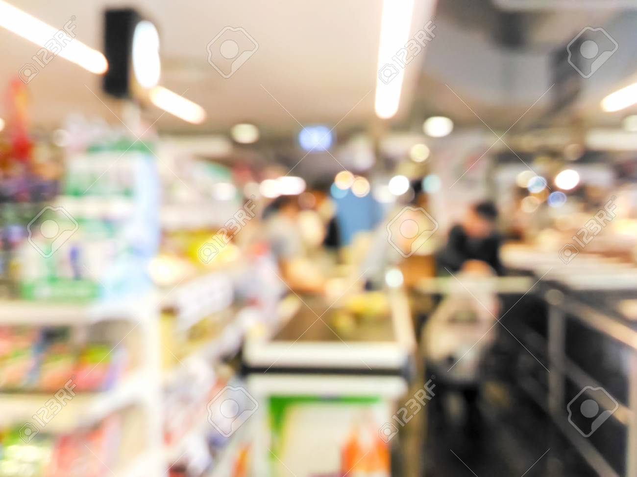 Cashier And Customer At Checkout Counter In Supermarket Background