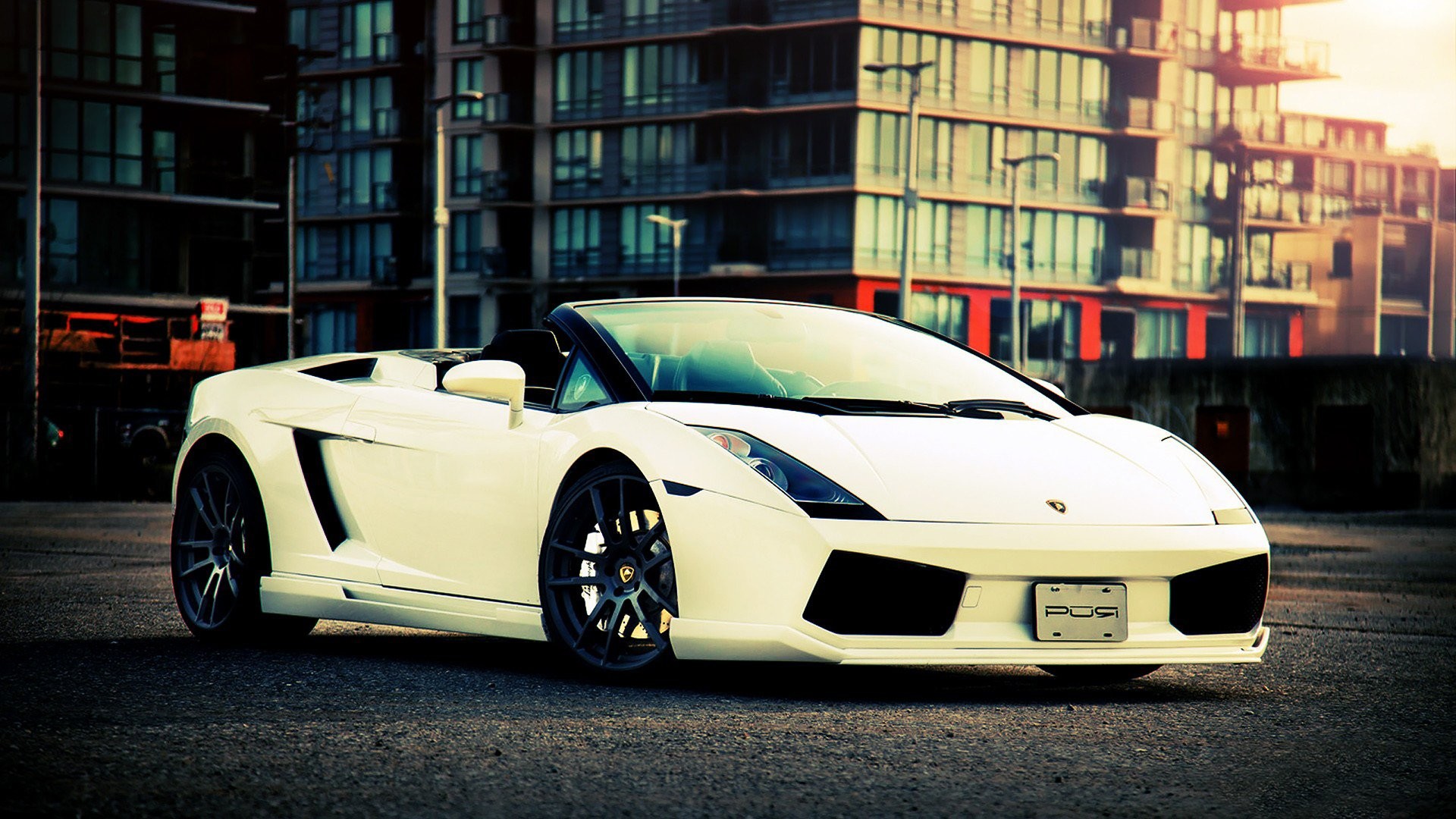 White Lamborghini Gallardo Spyder parked on a city street