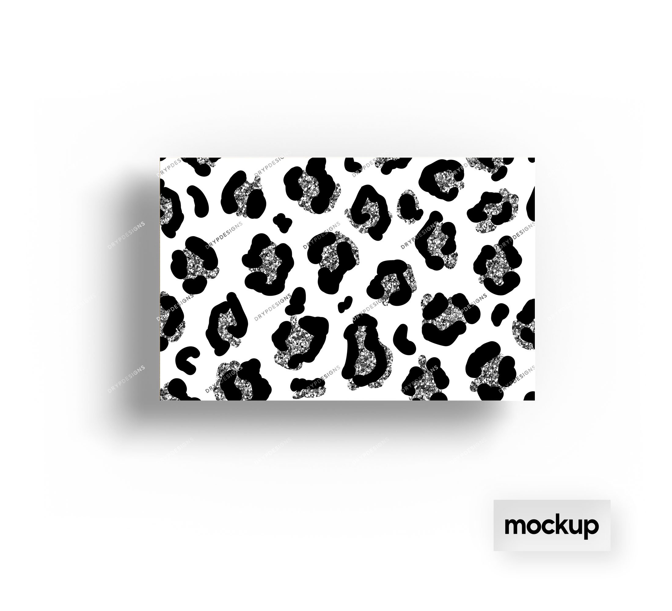 A mockup of a glitter leopard wallpaper, showcasing a white background with black leopard spots filled with silver glitter