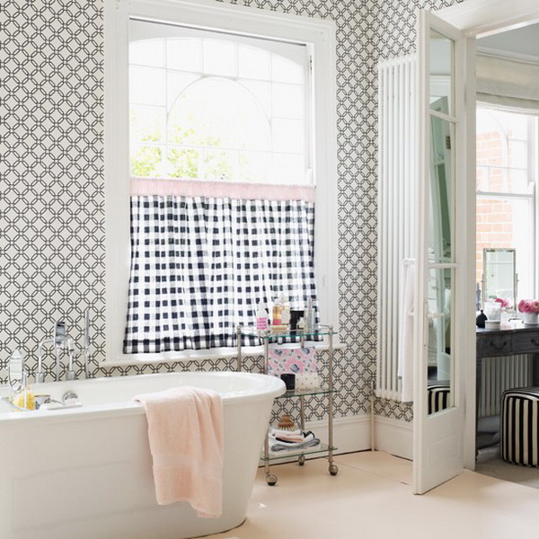 The geometric pattern on the bathroom wallpaper is timeless