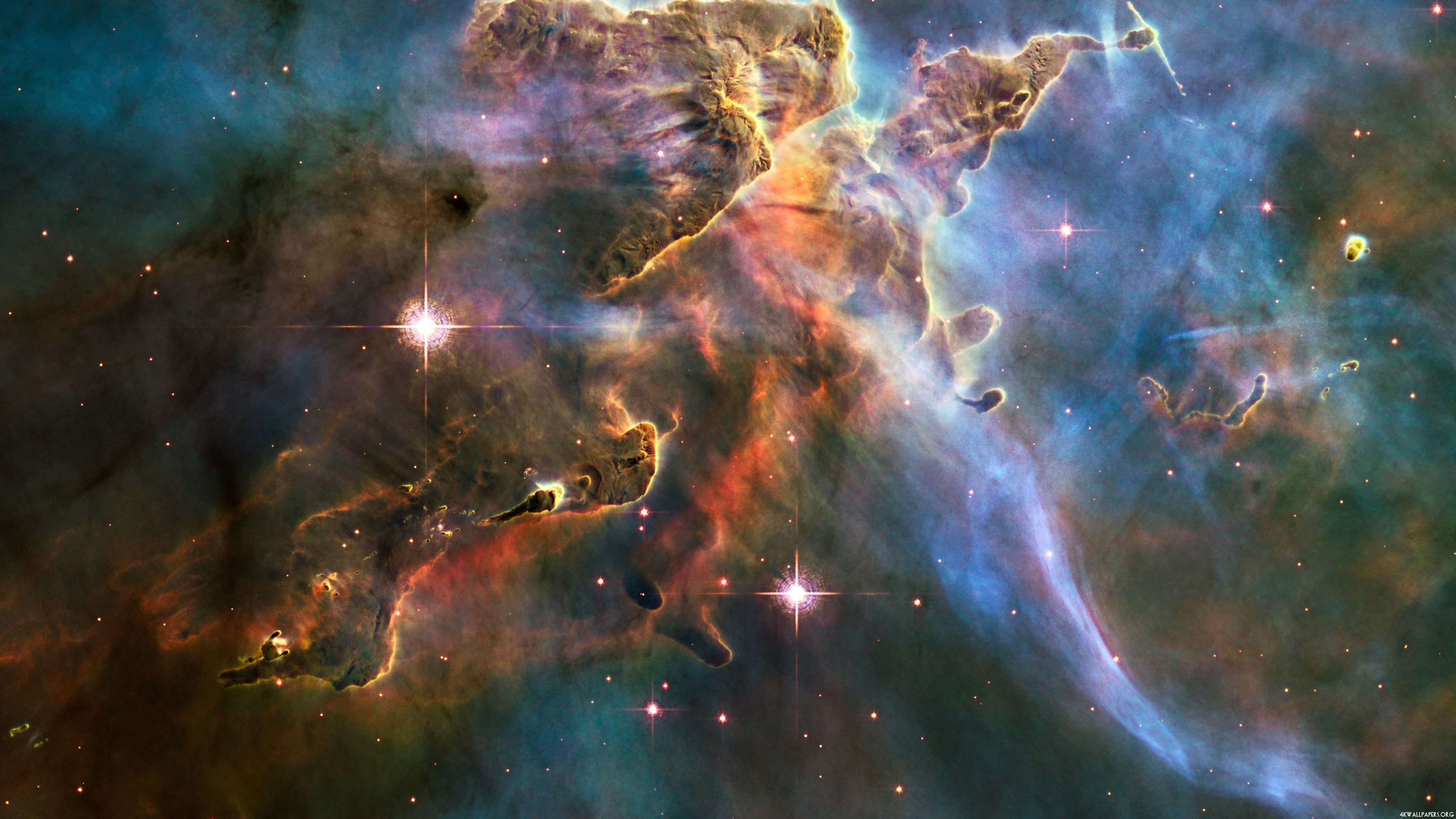A stunning 4k wallpaper of the Carina Nebula, showcasing vibrant colors and intricate details of this cosmic landscape