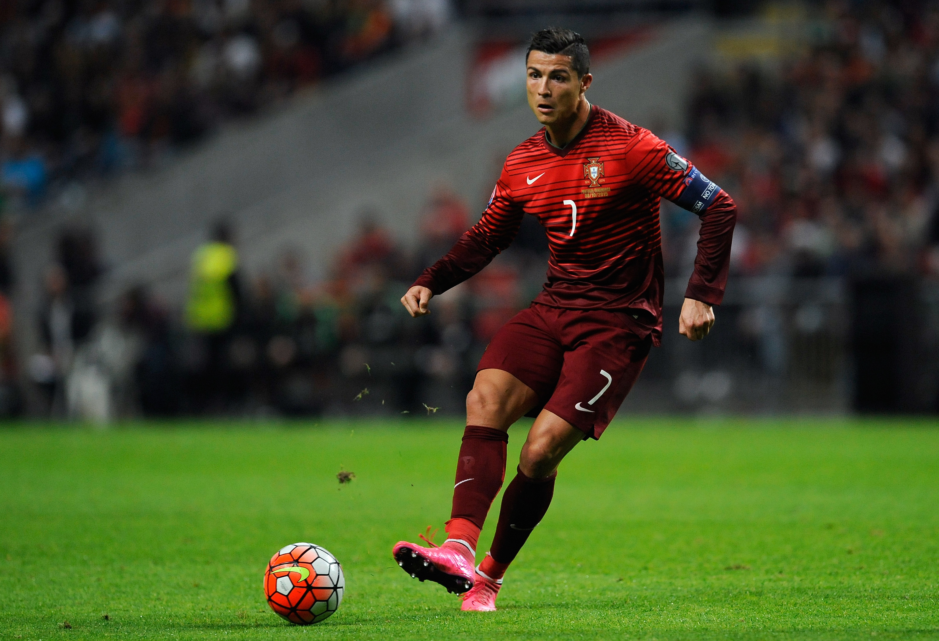 Cristiano Ronaldo dribbling the ball in a Portugal jersey