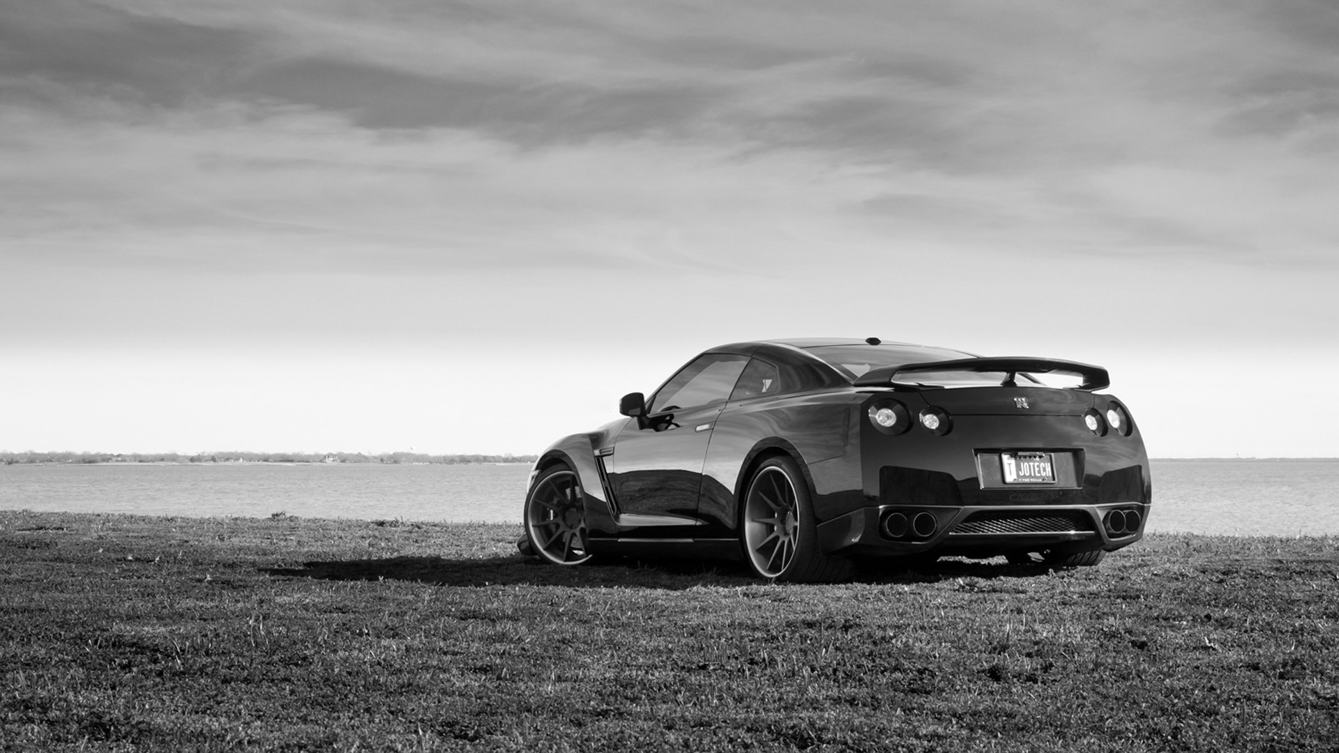 Black And White Photo Of A Car On The Beach Desktop Wallpaper