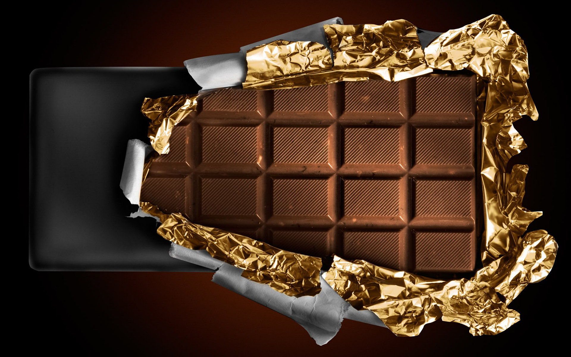 unwrapping a chocolate bar Wallpaper Background 29929