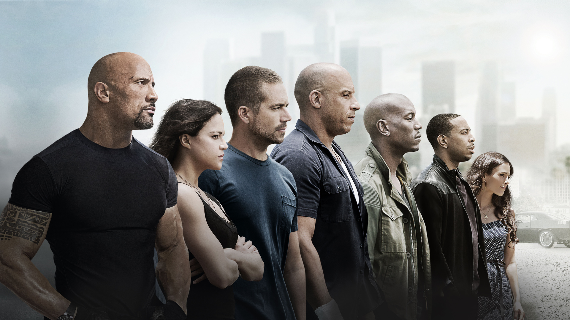 Promotional image for Furious 7 featuring the main cast: Dwayne 