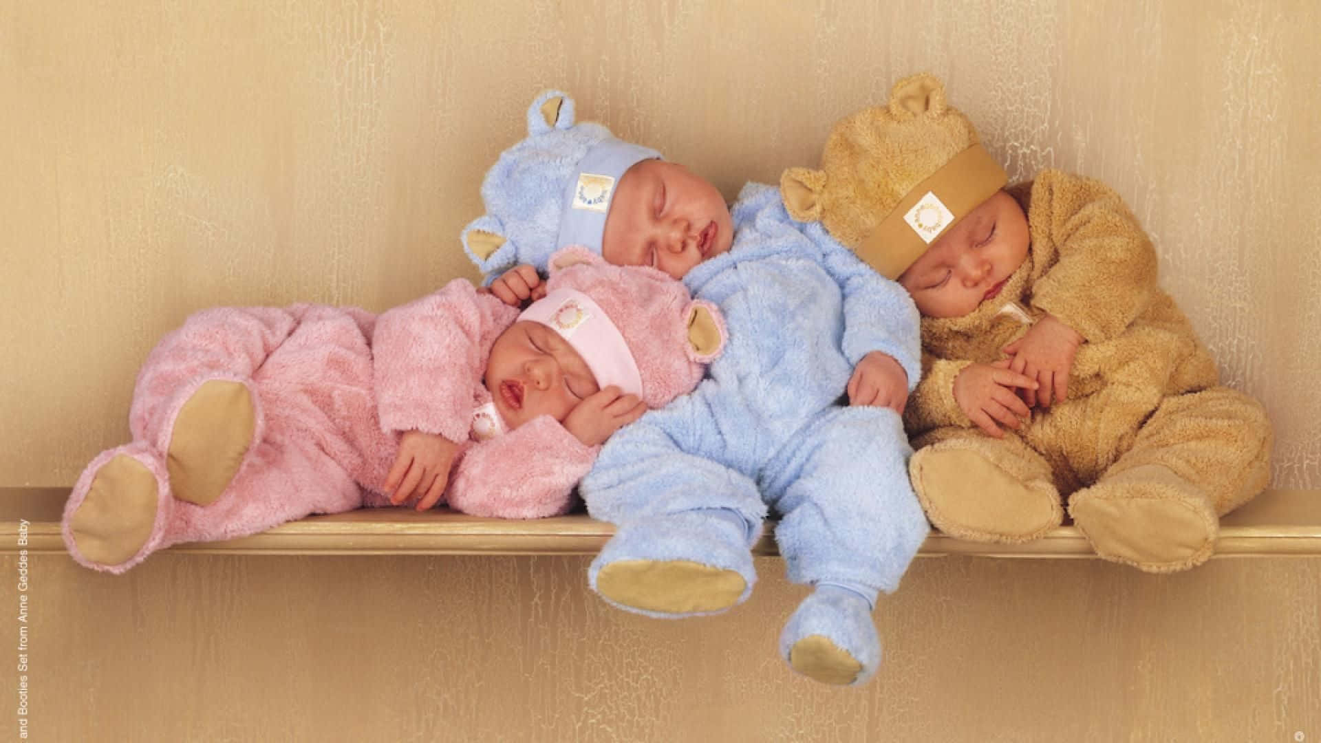 Identical Twin Toddlers In Matching Outfits Wallpaper