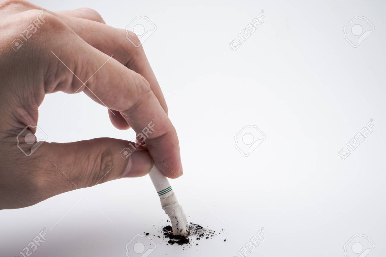 A Hand Push The Cigarette Stub On White Background Symbolic