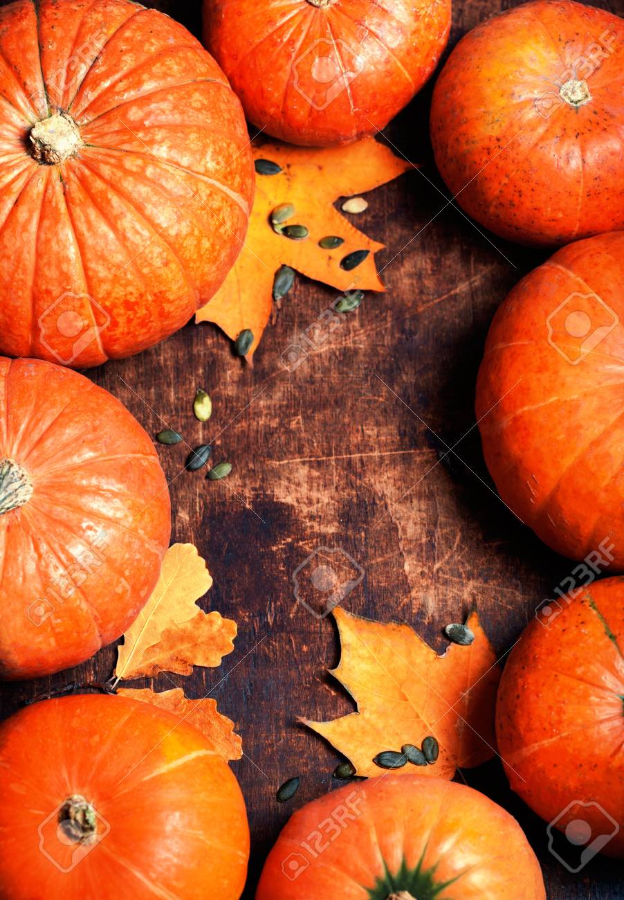 Autumn Wood Background With Pumpkins Over Wooden Table