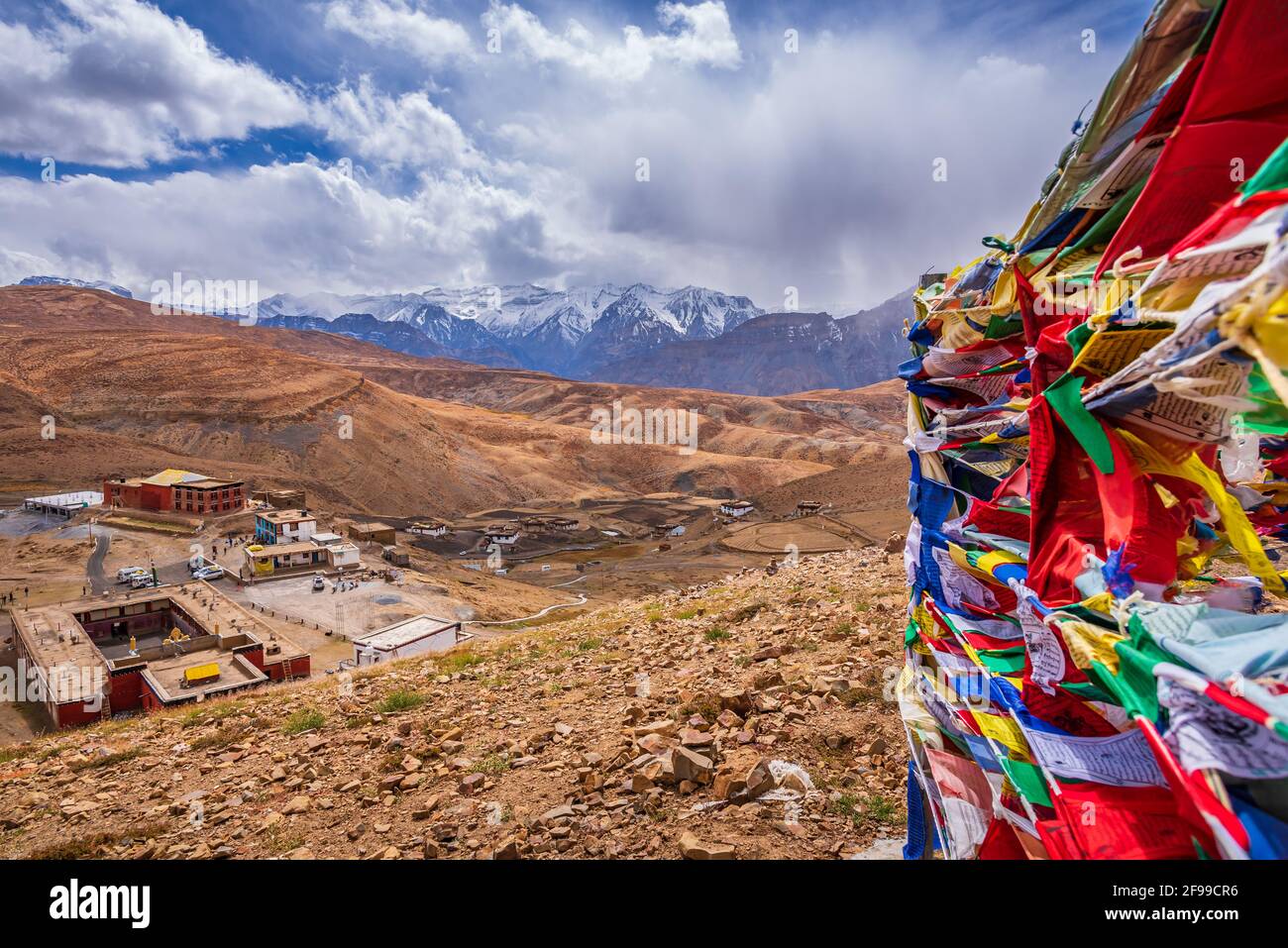 Colorful Prayer Flags Flying In Winds With Komic Village Nestled