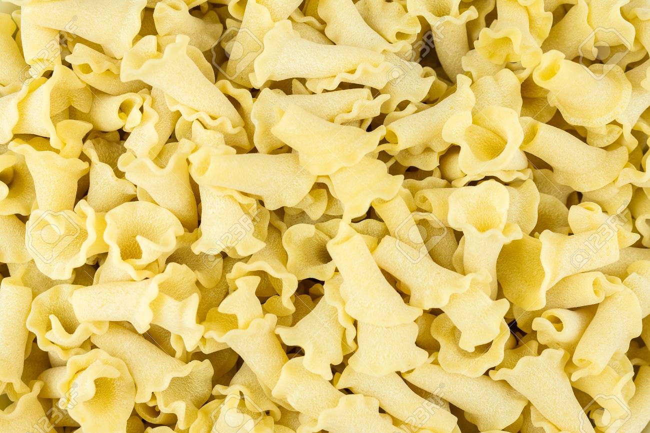 Closeup Of Uncooked Italian Pasta Campanelle Background