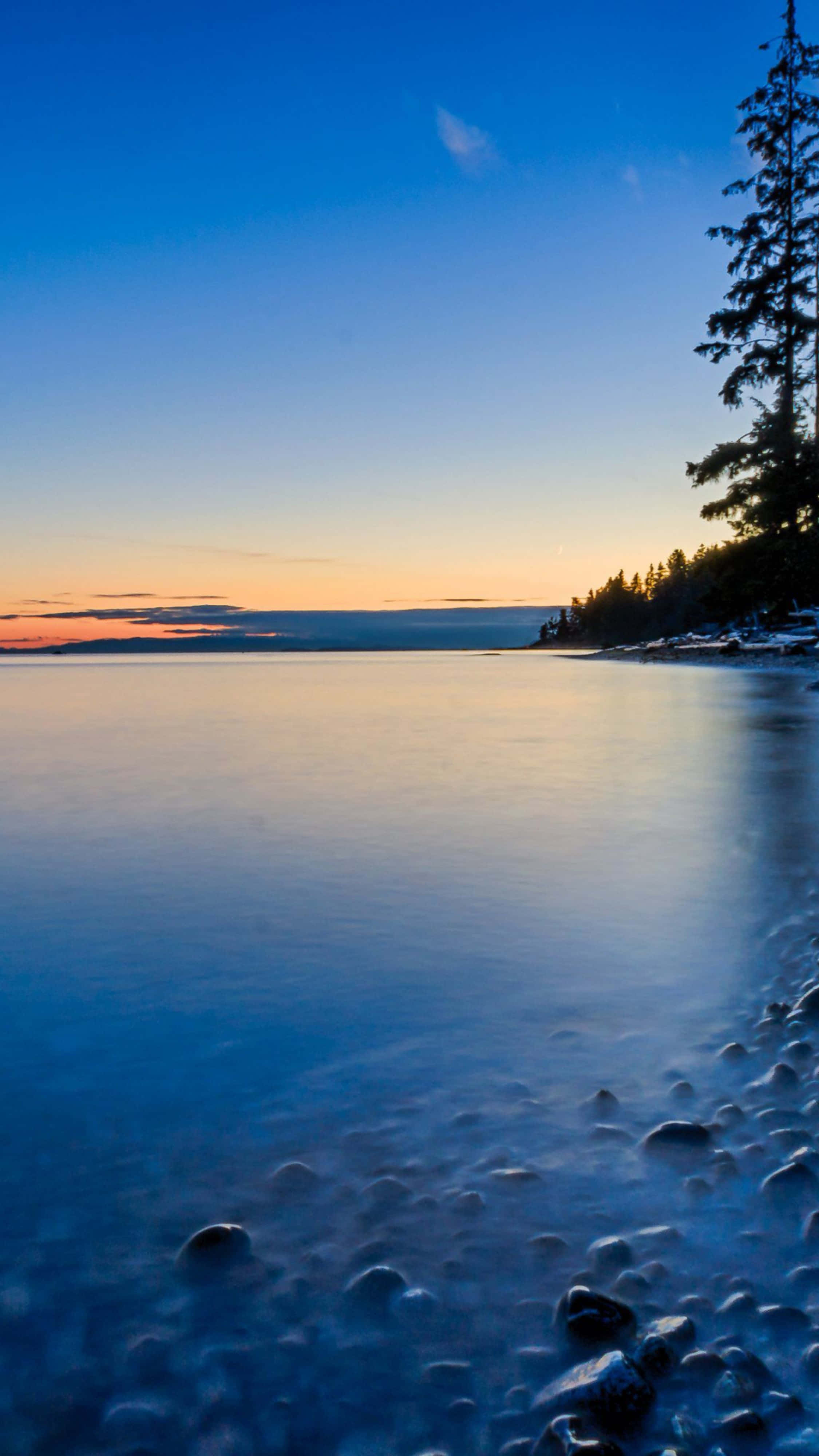 Serene Sunset Seascape: iPhone Pro 4k Wallpaper