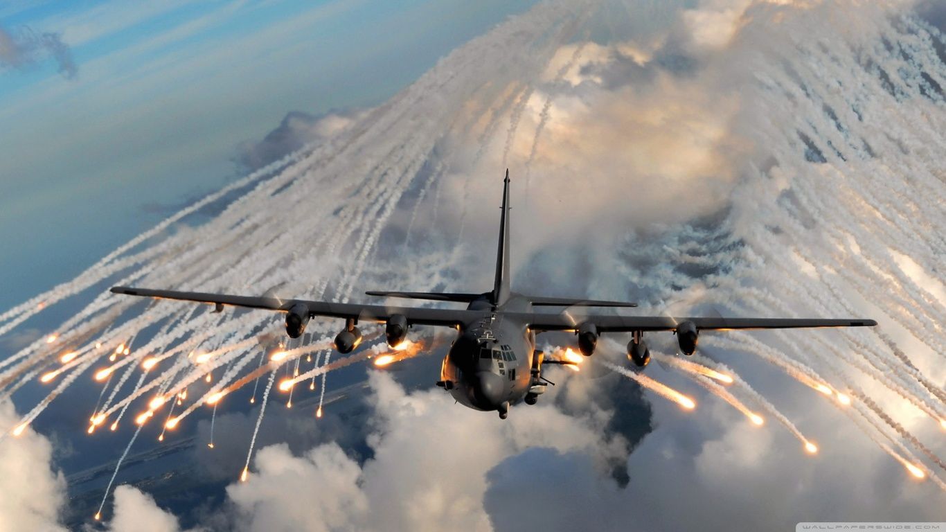 AC-130 Gunship Releasing Flares in Mid-Flight