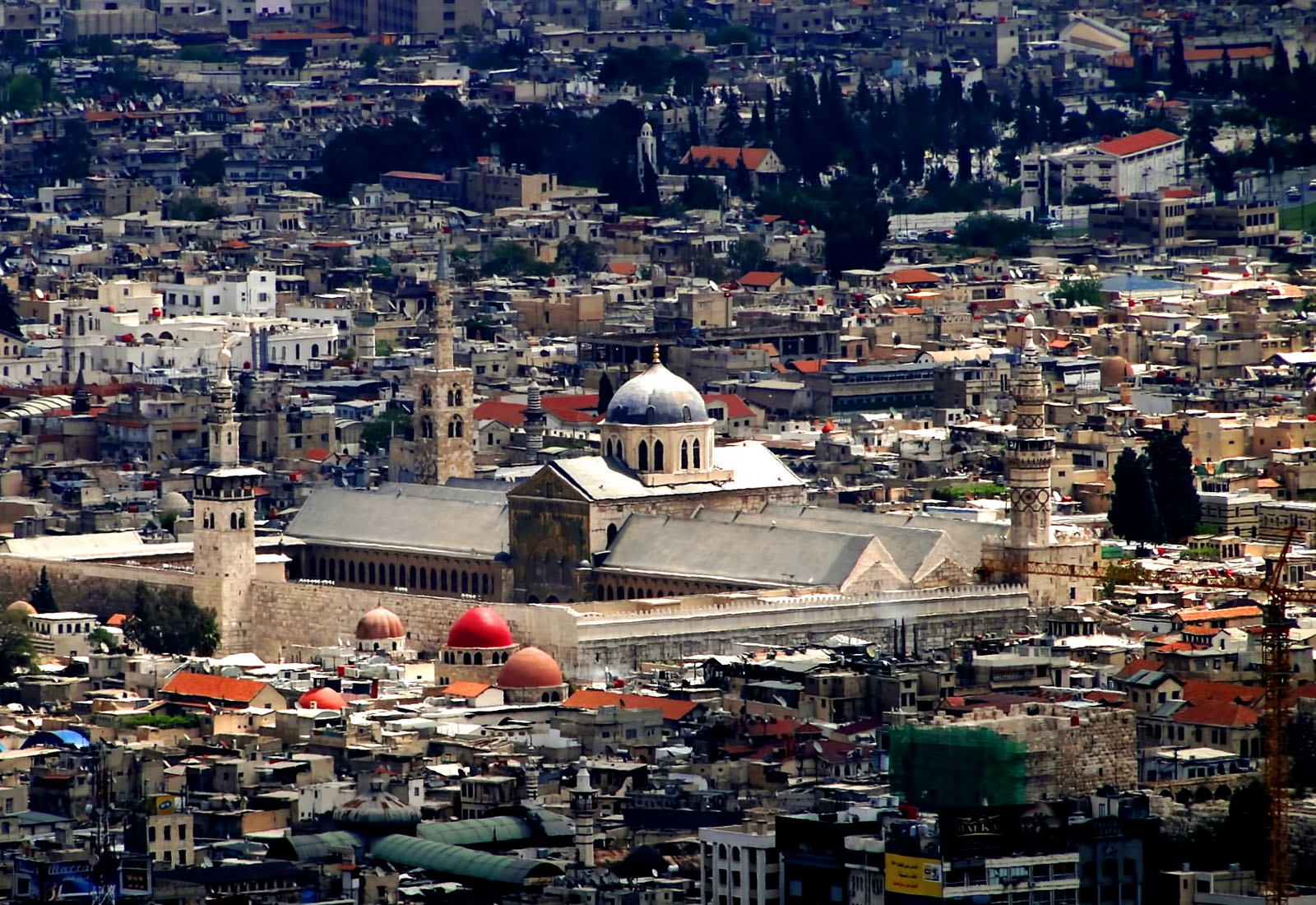 Aerial view of the Umayyad Mosque in Damascus, Syria, surrounded by the dense urban landscape