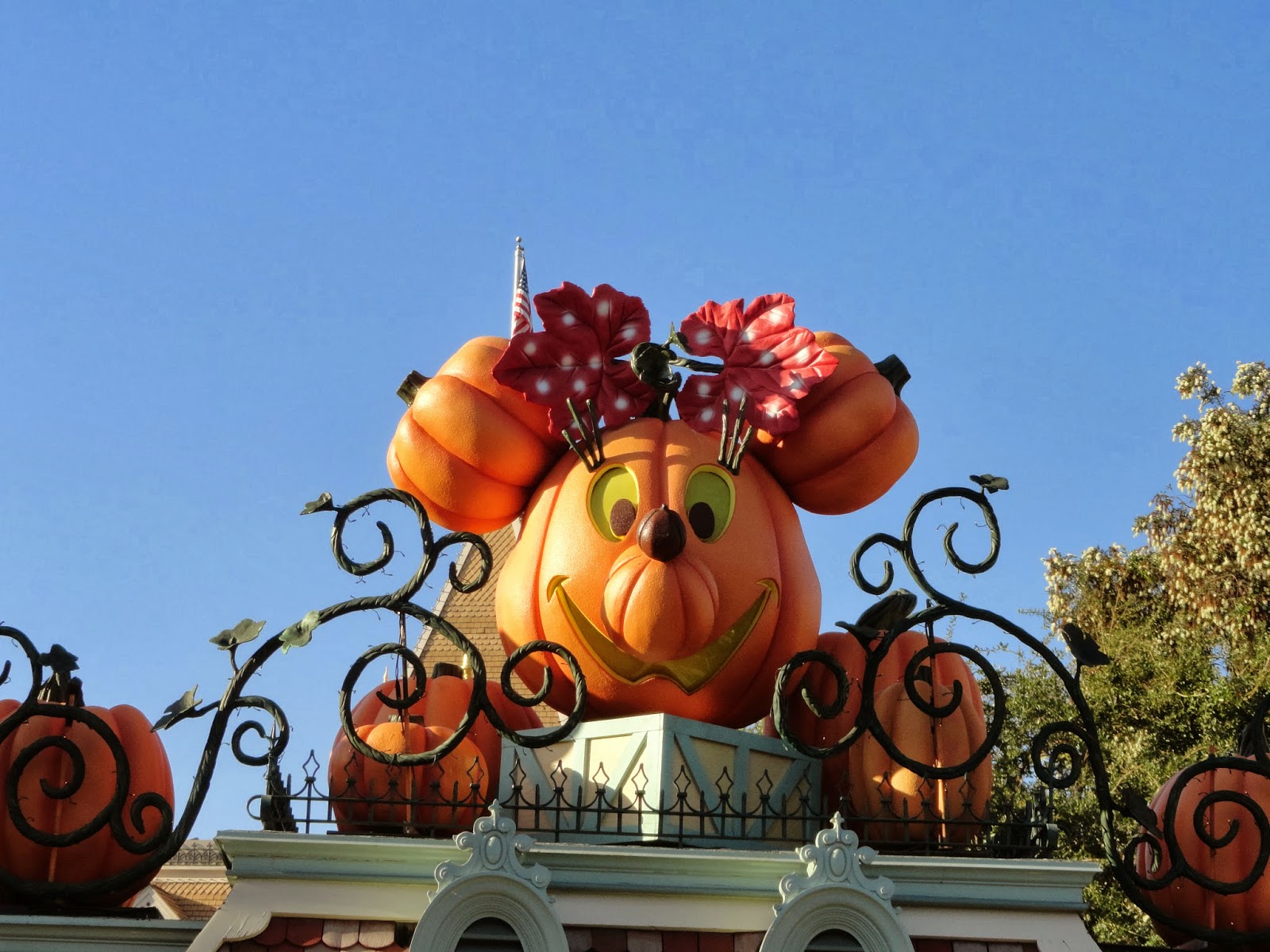 Giant inflatable pumpkin-shaped Minnie Mouse head decorated for Halloween at Disneyland park