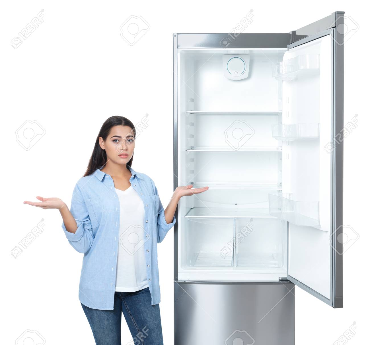 Emotional Woman Near Empty Refrigerator On White Background Stock