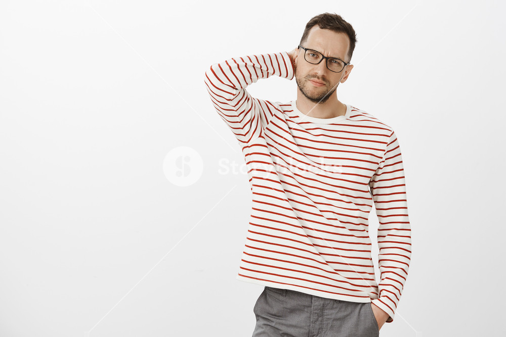 Indoor Shot Of Troubled Tired Businessman In Striped Clothes