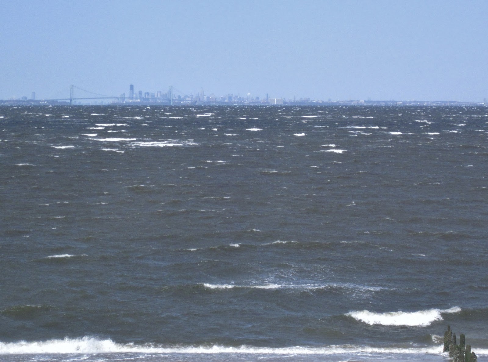 New York City In The Background With A Choppy Lower Bay Seen