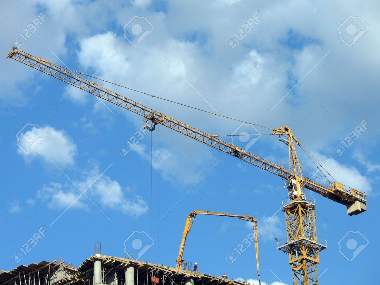 Yellow Tower Crane On A Construction Site Background Of