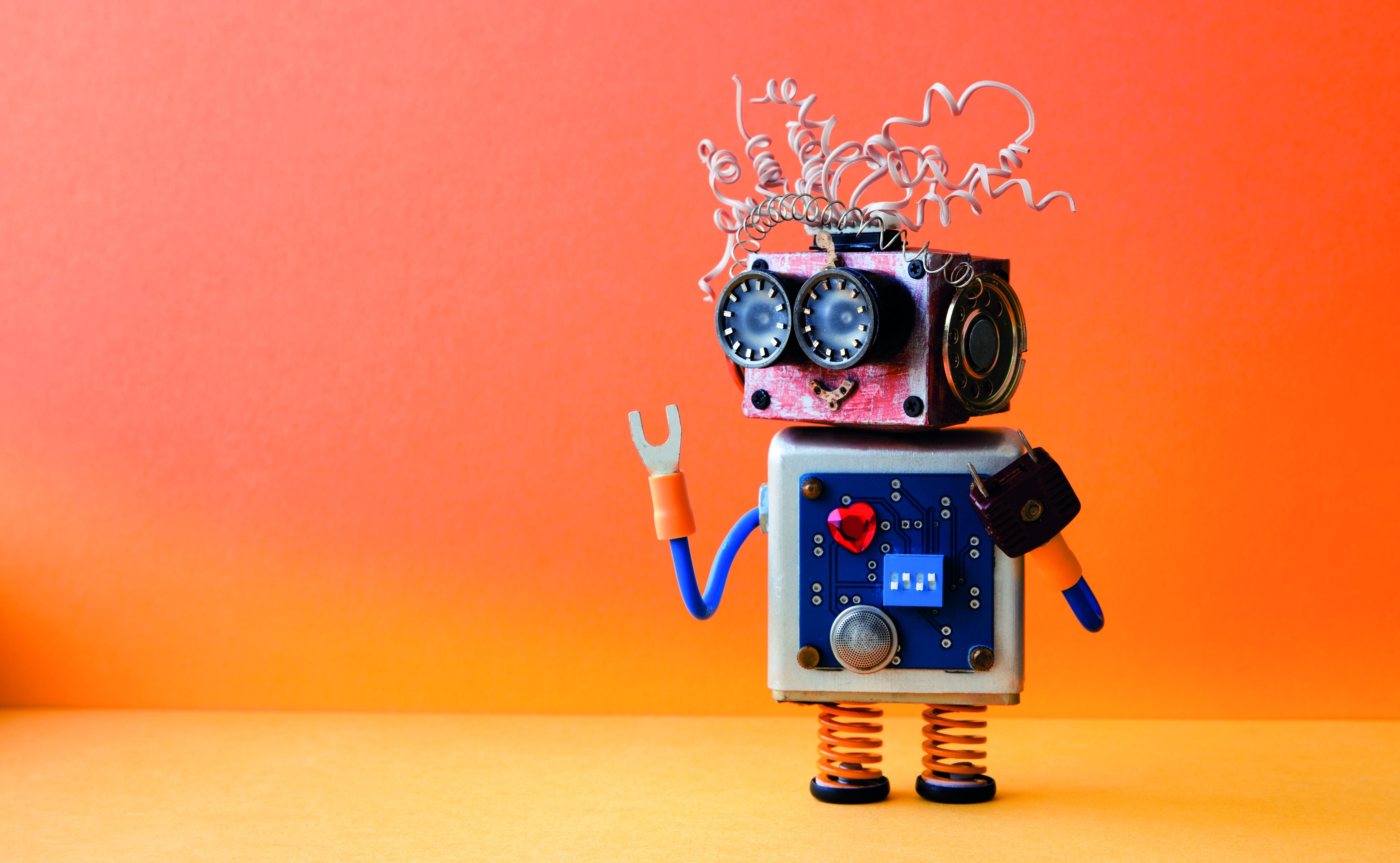 Friendly Crazy Robot Handyman On Orange Background Creative