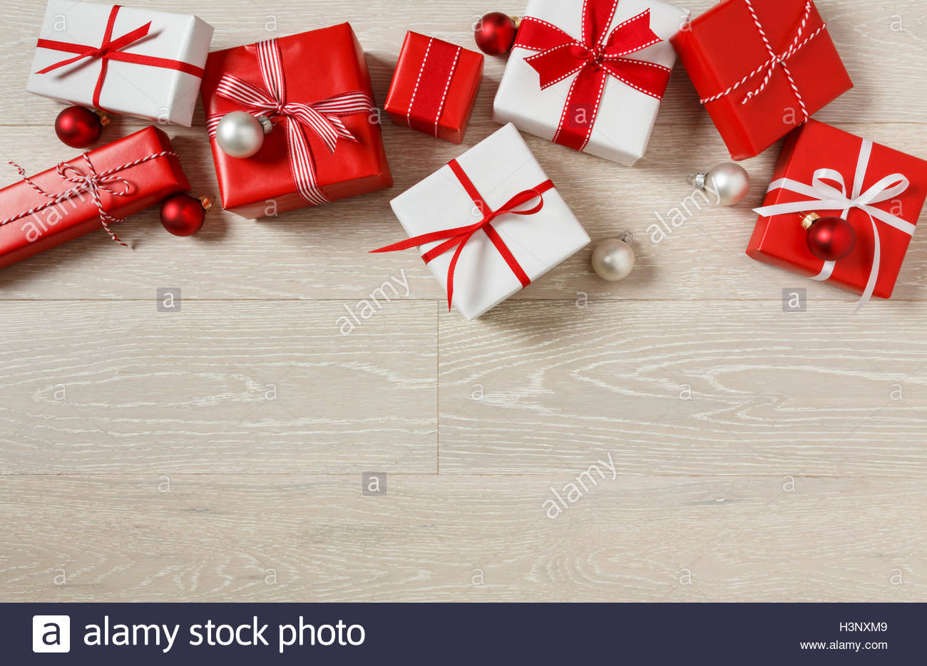 Christmas Gifts Presents On Rustic Wood Background Red And White