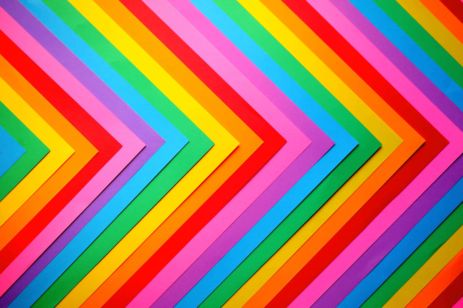 Colorful Paper With A Rainbow Arrow Wallpaper