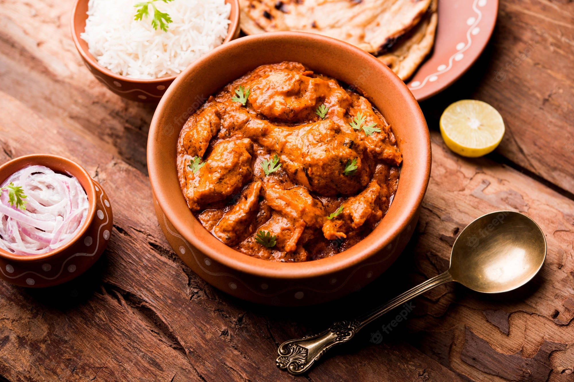 Sumptuous Butter Chicken Curry In Traditional Indian Wallpaper
