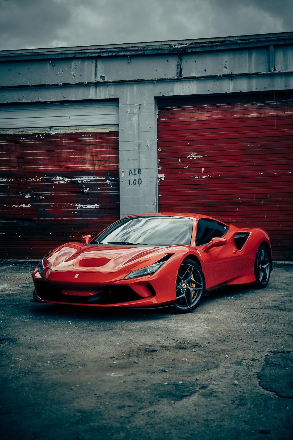 Red Ferrari Italia Parked Beside Wall Photo Car